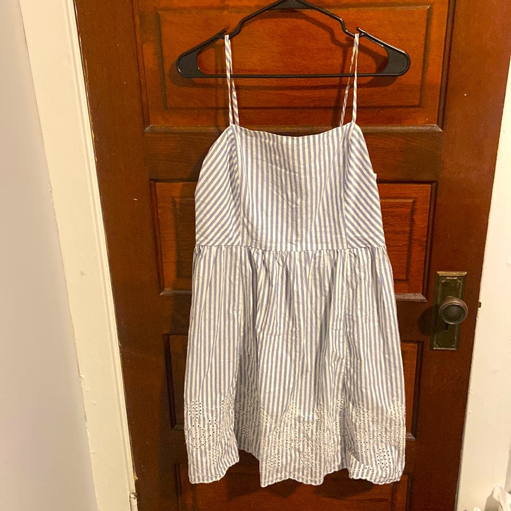 Blue and white striped dress with embroidered trim